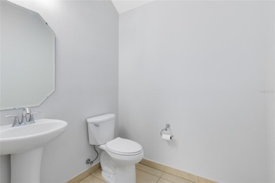 Welcome to this spacious end-unit townhome in the guard-gated on Eagle Creek Golf Club in Florida - for sale on GolfHomes.com, golf home, golf lot