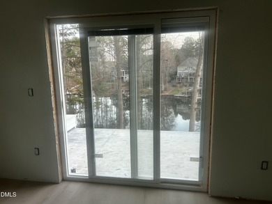 Discover lakeside luxury and convenience in this stunning on River Golf and Country Club at Lake Royale in North Carolina - for sale on GolfHomes.com, golf home, golf lot