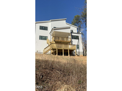 Discover lakeside luxury and convenience in this stunning on River Golf and Country Club at Lake Royale in North Carolina - for sale on GolfHomes.com, golf home, golf lot