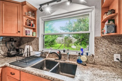 This stunning ranch-style home in beautiful Forest Hills offers on Babe Zaharias Golf Course in Florida - for sale on GolfHomes.com, golf home, golf lot