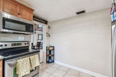 This stunning ranch-style home in beautiful Forest Hills offers on Babe Zaharias Golf Course in Florida - for sale on GolfHomes.com, golf home, golf lot