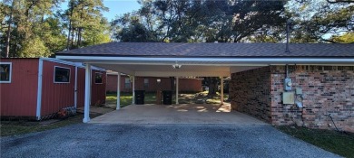 If you are looking for a 4-bedroom house with a large parking on Lake Forest Yacht and Country Club in Alabama - for sale on GolfHomes.com, golf home, golf lot