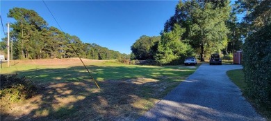 If you are looking for a 4-bedroom house with a large parking on Lake Forest Yacht and Country Club in Alabama - for sale on GolfHomes.com, golf home, golf lot