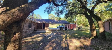 If you are looking for a 4-bedroom house with a large parking on Lake Forest Yacht and Country Club in Alabama - for sale on GolfHomes.com, golf home, golf lot