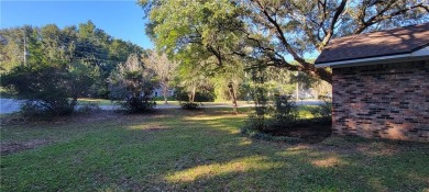 If you are looking for a 4-bedroom house with a large parking on Lake Forest Yacht and Country Club in Alabama - for sale on GolfHomes.com, golf home, golf lot