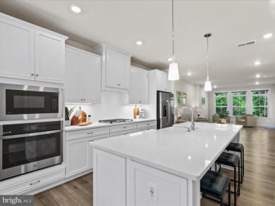 Welcome to 22198 Dune Circle, a gracious townhome villa offering on The Peninsula Golf and Country Club in Delaware - for sale on GolfHomes.com, golf home, golf lot
