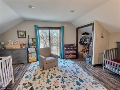 Tucked away in the woods on a spacious 1.8-acre lot, this modern on Whispering Pines Golf Club in Minnesota - for sale on GolfHomes.com, golf home, golf lot