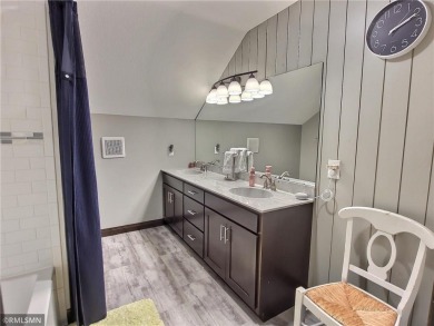 Tucked away in the woods on a spacious 1.8-acre lot, this modern on Whispering Pines Golf Club in Minnesota - for sale on GolfHomes.com, golf home, golf lot
