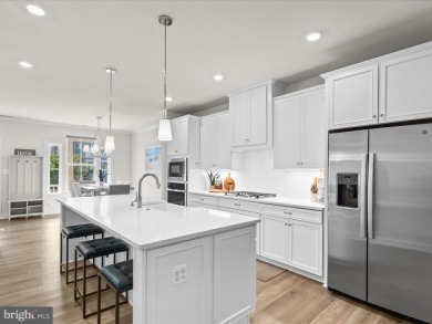 Welcome to 22198 Dune Circle, a gracious townhome villa offering on The Peninsula Golf and Country Club in Delaware - for sale on GolfHomes.com, golf home, golf lot