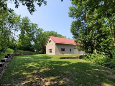 Tucked away in the woods on a spacious 1.8-acre lot, this modern on Whispering Pines Golf Club in Minnesota - for sale on GolfHomes.com, golf home, golf lot
