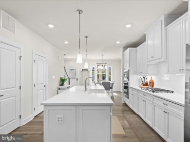 Welcome to 22198 Dune Circle, a gracious townhome villa offering on The Peninsula Golf and Country Club in Delaware - for sale on GolfHomes.com, golf home, golf lot
