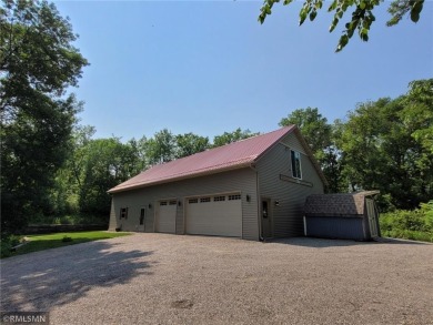 Tucked away in the woods on a spacious 1.8-acre lot, this modern on Whispering Pines Golf Club in Minnesota - for sale on GolfHomes.com, golf home, golf lot