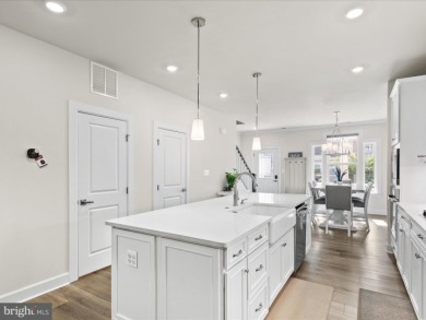 Welcome to 22198 Dune Circle, a gracious townhome villa offering on The Peninsula Golf and Country Club in Delaware - for sale on GolfHomes.com, golf home, golf lot