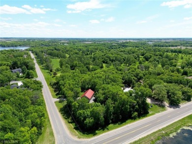 Tucked away in the woods on a spacious 1.8-acre lot, this modern on Whispering Pines Golf Club in Minnesota - for sale on GolfHomes.com, golf home, golf lot