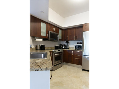 Spacious 2-bedroom, 2-bath residence located in Turnberry on Turnberry Isle Resort and Club in Florida - for sale on GolfHomes.com, golf home, golf lot