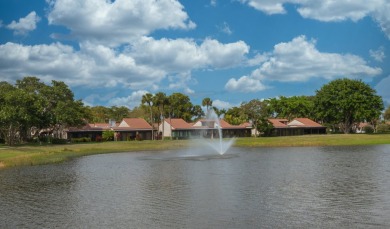 Discover an impeccable, fully renovated 2BR/2BA waterfront villa on Boca Lago Golf and Country Club in Florida - for sale on GolfHomes.com, golf home, golf lot