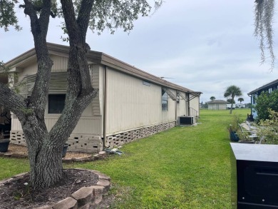 This furnished 2-bedroom, 2-bathroom singlewide located on lot on Anglers Green Golf Course in Florida - for sale on GolfHomes.com, golf home, golf lot