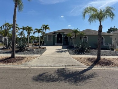 Gorgeous 3 Bedroom 2 Bathroom 3 Car Garage Plus Office/Den Pool on Apollo Beach Golf and Sea Club in Florida - for sale on GolfHomes.com, golf home, golf lot
