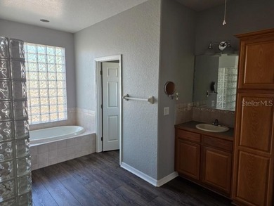 Gorgeous 3 Bedroom 2 Bathroom 3 Car Garage Plus Office/Den Pool on Apollo Beach Golf and Sea Club in Florida - for sale on GolfHomes.com, golf home, golf lot