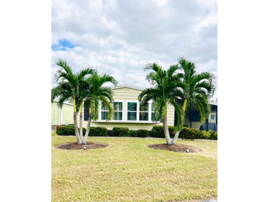 Discover this charming two-bedroom, two-bathroom home in the on Pine Lakes Country Club in Florida - for sale on GolfHomes.com, golf home, golf lot