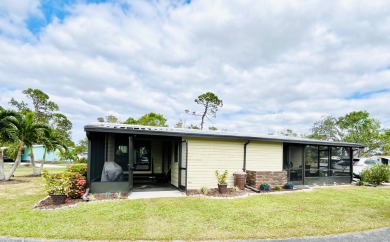 Discover this charming two-bedroom, two-bathroom home in the on Pine Lakes Country Club in Florida - for sale on GolfHomes.com, golf home, golf lot