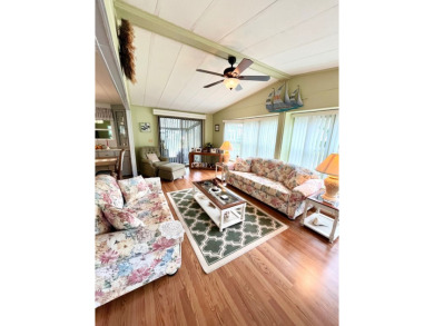 Discover this charming two-bedroom, two-bathroom home in the on Pine Lakes Country Club in Florida - for sale on GolfHomes.com, golf home, golf lot