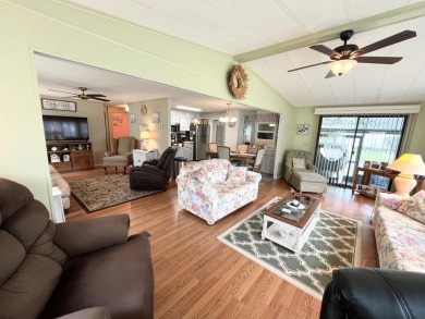 Discover this charming two-bedroom, two-bathroom home in the on Pine Lakes Country Club in Florida - for sale on GolfHomes.com, golf home, golf lot