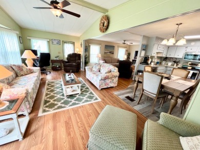 Discover this charming two-bedroom, two-bathroom home in the on Pine Lakes Country Club in Florida - for sale on GolfHomes.com, golf home, golf lot