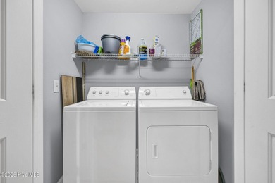 Experience the pinnacle of coastal living in this elegant on Sea Trail Golf Resort in North Carolina - for sale on GolfHomes.com, golf home, golf lot