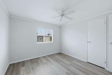 Welcome to this charming double-wide manufactured home located on Lemon Bay Golf Club in Florida - for sale on GolfHomes.com, golf home, golf lot