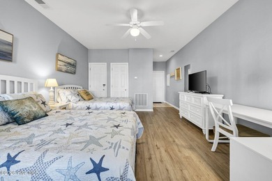 Experience the pinnacle of coastal living in this elegant on Sea Trail Golf Resort in North Carolina - for sale on GolfHomes.com, golf home, golf lot