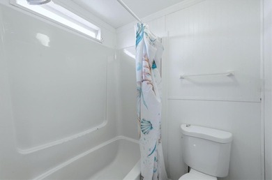 Welcome to this charming double-wide manufactured home located on Lemon Bay Golf Club in Florida - for sale on GolfHomes.com, golf home, golf lot