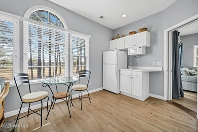 Experience the pinnacle of coastal living in this elegant on Sea Trail Golf Resort in North Carolina - for sale on GolfHomes.com, golf home, golf lot