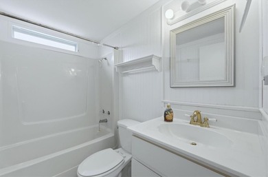 Welcome to this charming double-wide manufactured home located on Lemon Bay Golf Club in Florida - for sale on GolfHomes.com, golf home, golf lot