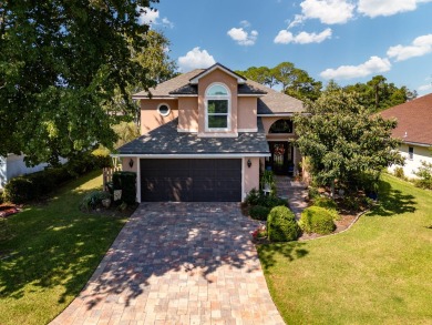 This inviting home, nestled on a small lake along the 3rd on Shalimar Pointe Golf and Country Club in Florida - for sale on GolfHomes.com, golf home, golf lot