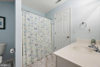 Direct bay views abound from this beautiful 2-story condo in on Bethany Bay Golf Club in Delaware - for sale on GolfHomes.com, golf home, golf lot
