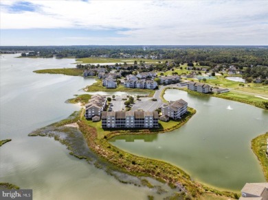 Direct bay views abound from this beautiful 2-story condo in on Bethany Bay Golf Club in Delaware - for sale on GolfHomes.com, golf home, golf lot
