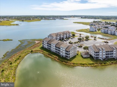 Direct bay views abound from this beautiful 2-story condo in on Bethany Bay Golf Club in Delaware - for sale on GolfHomes.com, golf home, golf lot