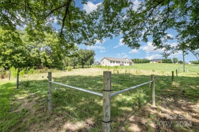 Over 9 acres of beautiful pasture with gentle rolling hills on Woodbridge Golf Links in North Carolina - for sale on GolfHomes.com, golf home, golf lot