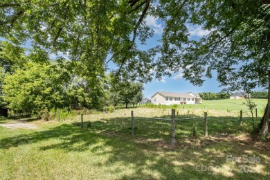 Over 9 acres of beautiful pasture with gentle rolling hills on Woodbridge Golf Links in North Carolina - for sale on GolfHomes.com, golf home, golf lot