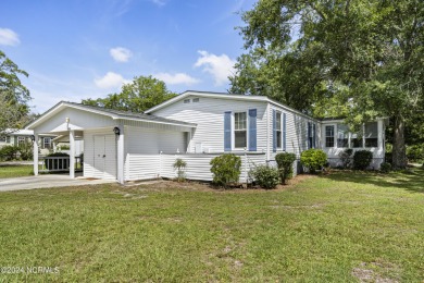 This home is nestled on a picturesque homesite on a quaint on Topsail Green Golf Club in North Carolina - for sale on GolfHomes.com, golf home, golf lot