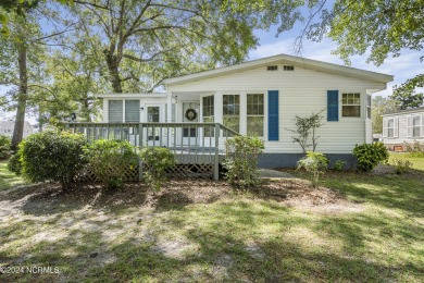 This home is nestled on a picturesque homesite on a quaint on Topsail Green Golf Club in North Carolina - for sale on GolfHomes.com, golf home, golf lot