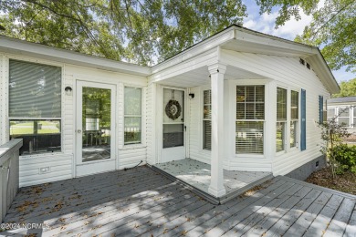 This home is nestled on a picturesque homesite on a quaint on Topsail Green Golf Club in North Carolina - for sale on GolfHomes.com, golf home, golf lot