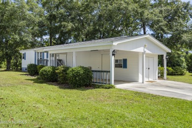 This home is nestled on a picturesque homesite on a quaint on Topsail Green Golf Club in North Carolina - for sale on GolfHomes.com, golf home, golf lot