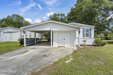 This home is nestled on a picturesque homesite on a quaint on Topsail Green Golf Club in North Carolina - for sale on GolfHomes.com, golf home, golf lot