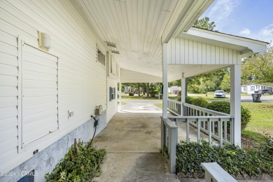 This home is nestled on a picturesque homesite on a quaint on Topsail Green Golf Club in North Carolina - for sale on GolfHomes.com, golf home, golf lot