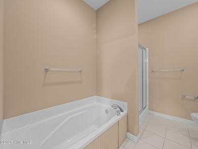 This thoughtfully designed 3-bedroom, 2-bath single-level condo on Brandywine Bay Golf Club in North Carolina - for sale on GolfHomes.com, golf home, golf lot
