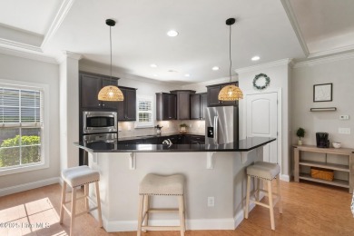 Easy living in this luxury townhome in the highly desirable on Cape Fear National At Brunswick Forest in North Carolina - for sale on GolfHomes.com, golf home, golf lot