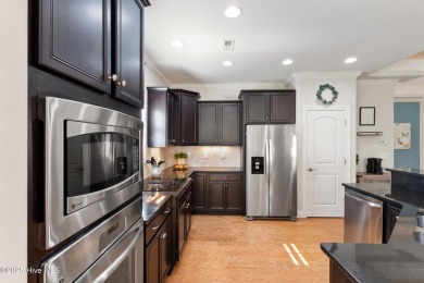 Easy living in this luxury townhome in the highly desirable on Cape Fear National At Brunswick Forest in North Carolina - for sale on GolfHomes.com, golf home, golf lot