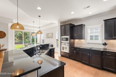 Easy living in this luxury townhome in the highly desirable on Cape Fear National At Brunswick Forest in North Carolina - for sale on GolfHomes.com, golf home, golf lot